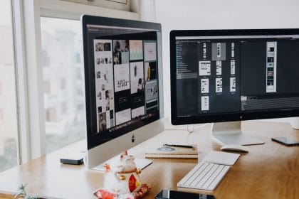 two computer screens displaying web page design elements