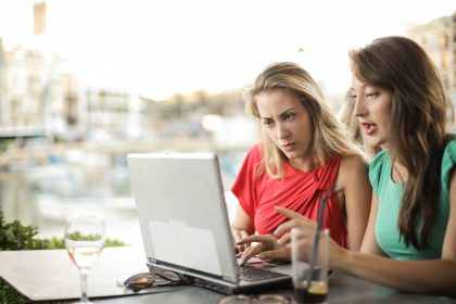 two_women_looking_at_a_laptop_computer