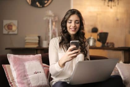 woman looking at cell phone