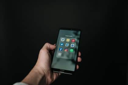 cell phone screen with social media icons for social media advertising